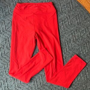 LulaRoe Tween red leggings.